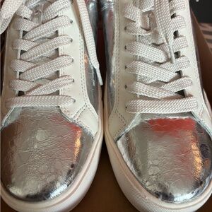 NWOT.  Dolce Vita Silver and White Sneakers with Metallic Toe Cap